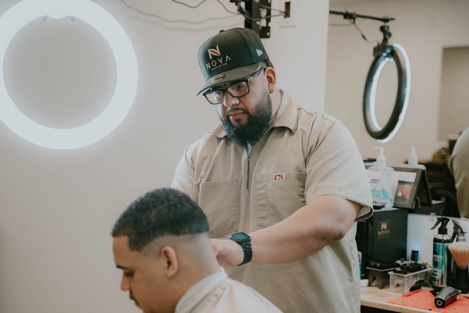 Barber giving a client a skin fade